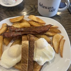 Delaware Cafe - One of the breakfast specials that comes with coffee! Two eggs, toast, bacon. I subbed the home fries for French fries.