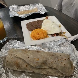 Mexican breakfast burrito and huevos rancheros plate