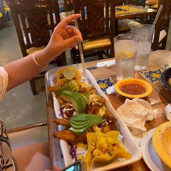 El Agave's Mexican Restaurant - a woman sitting at a table with a plate of food - Mexican Near Me - Hope, Arkansas
