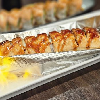 Blufish Sushi & Grill - Salmon on Fire. In: Spicy Crab, Avo, Cream Cheese. Out: Baked Salmon. Sauce: Eel - Sushi Bars Near Me - Azusa, California