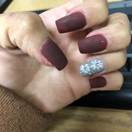 So you can see the white specs on my nail. Love the design.