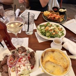 Wedge salad with steak, french onion soup, dirty vodka martini, lobster roll