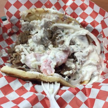 River Grill Pizza & Deli - a half eaten sandwich - Mediterranean Near Me - Minneapolis, Minnesota River Grill Pizza & Deli - a half eaten sandwich - Mediterranean Near Me - Minneapolis, Minnesota