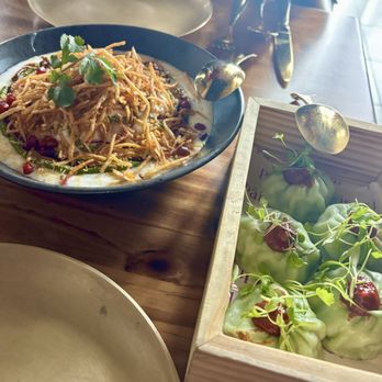 Pippal - Daho Vadal Chaat (lentil fritters in mint yogurt sauce, crispy potato straws, pomegranate) and Pan Seared Mixed Vegetable Momo (dumplings). - Indian Near Me - Emeryville, California