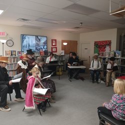 Cameron Public Library - A Christmas Carol reading in period-ish attire.
