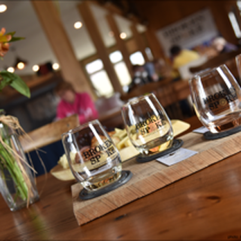 Broken Spoke Winery - Our typical wine tasting flight is presented on a board with a horseshoe hugging each of the four wines for tasting. - Wineries Near Me - Earleville, Maryland