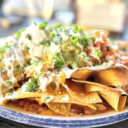 The Chicken Place Latin Rotisserie & Cocktail Bar - Chicken nachos were so so. Chicken was dry and the chips got soggy fast due to the beans at the bottom of the plate.