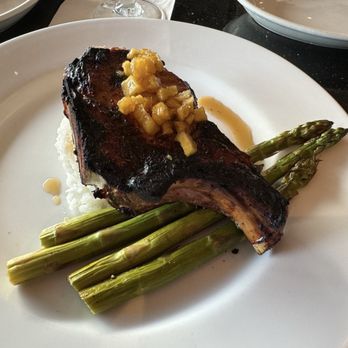 Table at Poipu - Pork chop with substituted asparagus for green beans and rice instead of potato. - New American Near Me - Koloa, Hawaii