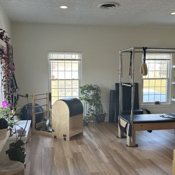 Body Intuit - Front room with her reformers - Pilates Near Me - Worthington, Ohio