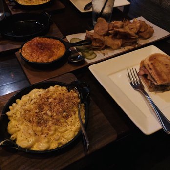 Bosscat Kitchen & Libations - clockwise from top: hot chicken dip and chips, BC press, mac & cheese - New American Near Me - Houston, Texas