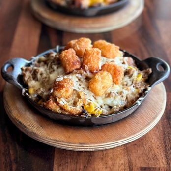 Mason Jar Kitchen & Bar - MODERN (vegan) TATER TOT HOTDISH: seasoned Beyond Meat, corn, house-made dairy-free cream of mushroom, tater tots, plant-based mozzarella. - New American Near Me - Eagan, Minnesota
