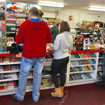Bishops Store - a man and a woman at a cash register - Gas Stations Near Me - Jackman, Maine Bishops Store - a man and a woman at a cash register - Gas Stations Near Me - Jackman, Maine
