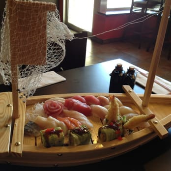 Sushi Express - This love boat has 16pcs sashimi, 8pcs sushi, and a dragon roll w/shrimp tempura inside! It is very delicious with a fair price! - Japanese Near Me - Madison, Wisconsin