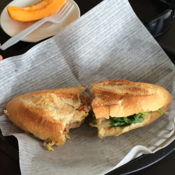 Insomnia - The new breakfast sandwich special: sautéed onions, ham, and eggs, a bit of cilantro, and some sriracha sauce - Coffee & Tea Near Me - Honolulu, Hawaii