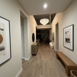 Large framed pictures and mirror hung by Hangers Art Installation Large framed pictures and mirror hung by Hangers Art Installation