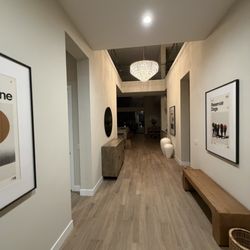 Hangers Art Installation - Large framed pictures and mirror hung by Hangers Art Installation