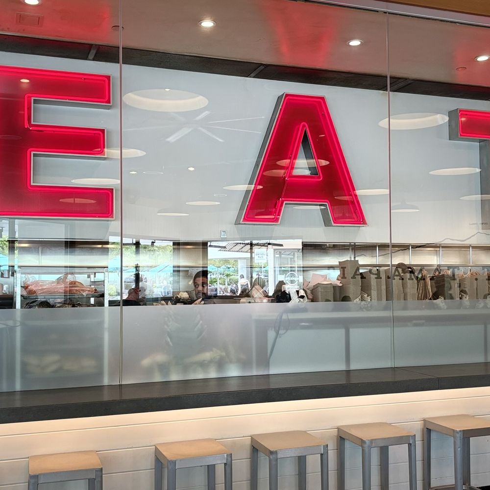 EAT neon sign through glass: The classic Gott's red neon EAT neon sign through glass: The classic Gott's red neon