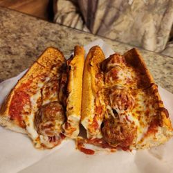 ABC Pizza International - Billy's Grinder: A combination of meatballs and pepperoni made with our special tomato sauce and a blend of melted cheeses