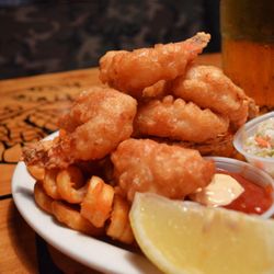 Dive into a seafood paradise with our delectable Fried Shrimp, perfectly paired with a squeeze of zesty lemon!