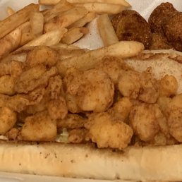 Shrimp Po'boy with fries and hush puppies Shrimp Po'boy with fries and hush puppies