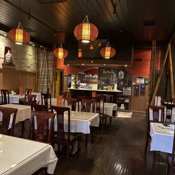 Thai Tamarind Restaurant - a woman sitting at a table - Thai Near Me - Belmont, California Thai Tamarind Restaurant - a woman sitting at a table - Thai Near Me - Belmont, California