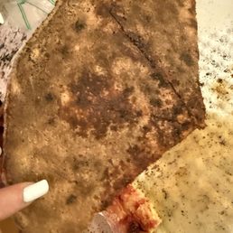 Burnt bottom half of pizza Burnt bottom half of pizza