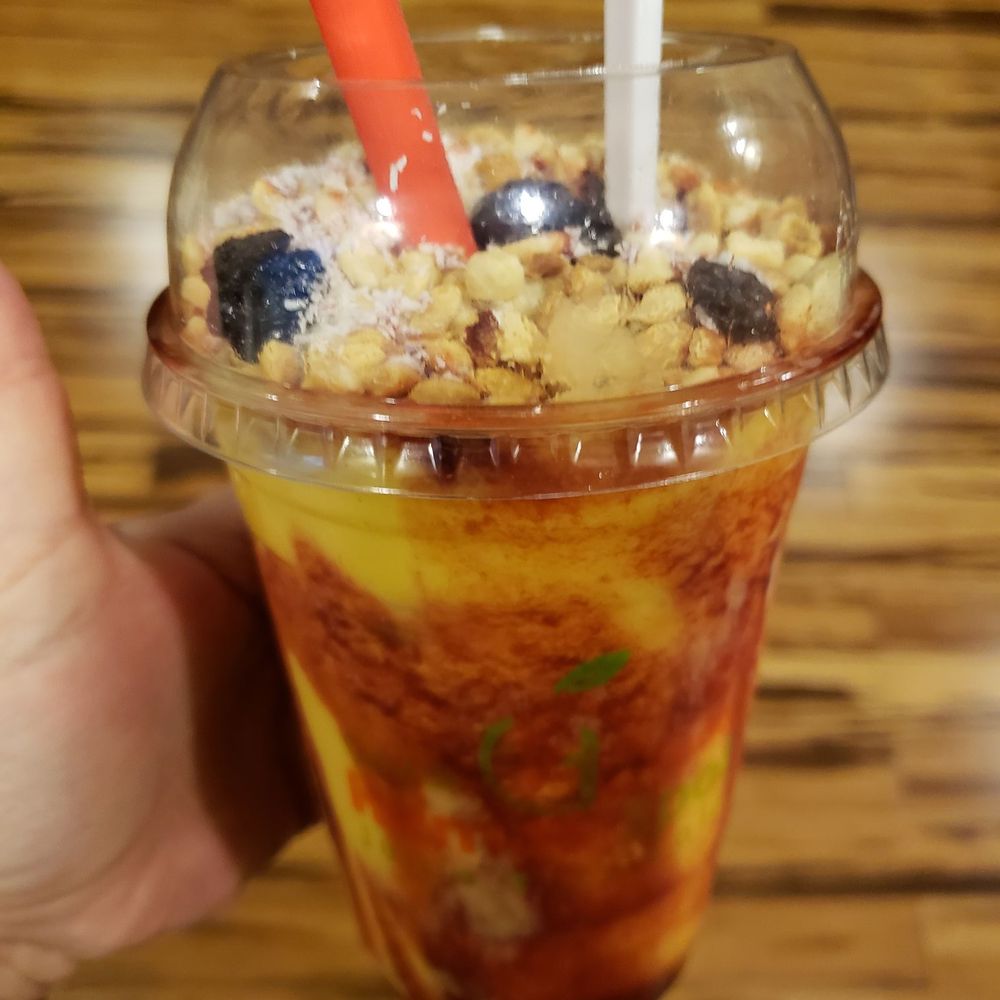 Araisy-mango smoothie w/peanuts, raisins, coconut-delicious Araisy-mango smoothie w/peanuts, raisins, coconut-delicious
