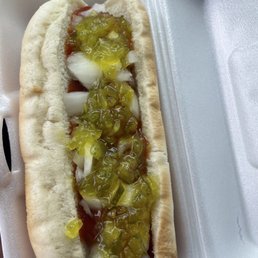 a hot dog in a styrofoam container a hot dog in a styrofoam container