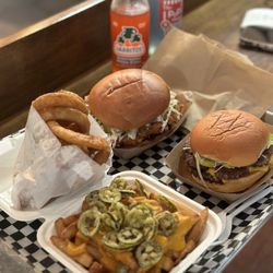 Cabano's Comfort Food - OG chicken burger, Cabano's burger, onion rings, spicy cheese fries