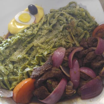 aji limon peruvian restaurant - Green spaghetti (think fettuccine with a rich pesto sauce) with salted beef. - Peruvian Near Me - Cape Coral, Florida