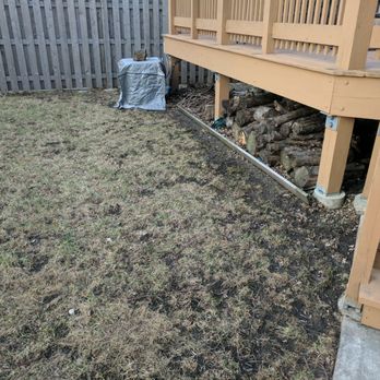 Certified VIP Landscaping - a back yard with a firewood pile - Snow Removal Near Me Certified VIP Landscaping - a back yard with a firewood pile - Snow Removal Near Me