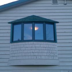 Suburban Construction - Bow window with shake accents in Fyre Lake