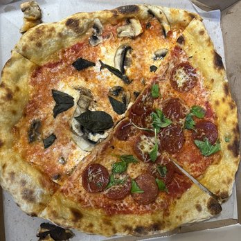 Philomena's - Saucey with shrooms on left and pepperoni on right. Two halves of leftover personal pies. - Pizza Near Me - Sunnyside, New York