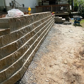 American Tree & Landscaping - a stone retaining wall - Tree Services Near Me - Dumfries, Virginia American Tree & Landscaping - a stone retaining wall - Tree Services Near Me - Dumfries, Virginia
