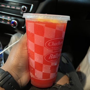 Checkers - a person holding a cup of juice - Burgers Near Me - Miramar, Florida