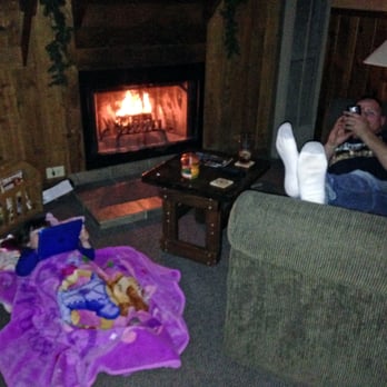 Idle Hour Lodge - Our cozy living room - husband and daughter relaxing at the end of the day by the fire - Guest Houses Near Me - Ruidoso, New Mexico Idle Hour Lodge - Our cozy living room - husband and daughter relaxing at the end of the day by the fire - Guest Houses Near Me - Ruidoso, New Mexico