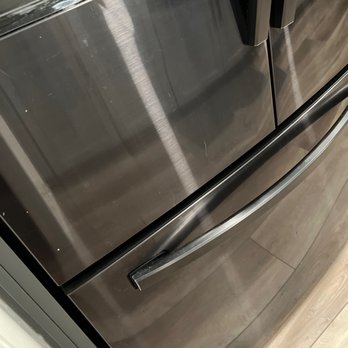 Delerio Construction - Door has a big dent. - General Contractors Near Me - Fresno, California