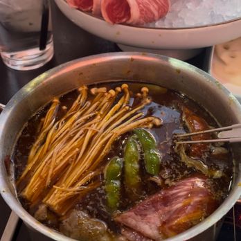 The Bronze Empire - Spicy Pot with enoki mushrooms, lotus root, and Beef Brisket - Hot Pot Near Me - Denver, Colorado The Bronze Empire - Spicy Pot with enoki mushrooms, lotus root, and Beef Brisket - Hot Pot Near Me - Denver, Colorado