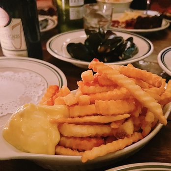 Heart's - a plate of french fries and a bottle of wine - Gastropubs Near Me - Kimberley, Ontario