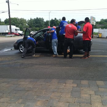 Magic Touch Auto Spa - A Team of men wiping down one car. - Car Wash Near Me - Lodi, New Jersey