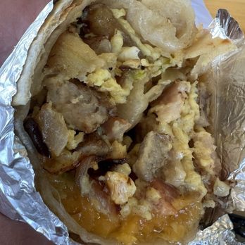 La Guagua - Breakfast burrito. Tasted all the ingredients that wasn't jam packed with potatoes. The salsa with it was good too. Delicious!! - Latin American Near Me - Vacaville, California