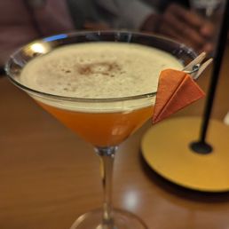 Paper plane cocktail with a tiny paper plane on it!