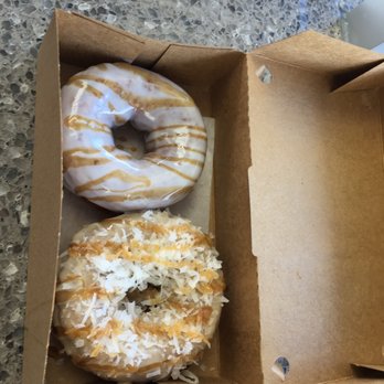 Duck Donuts - Vanilla frosting with salted caramel and peanut butter frosted with coconut and caramel drizzle. The vanilla one was better. - Donuts Near Me - Rockville, Maryland