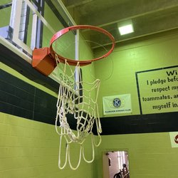 YMCA - Lowered goal to about 8 ft with torn net and exposed wire. This is an injury hazard.
