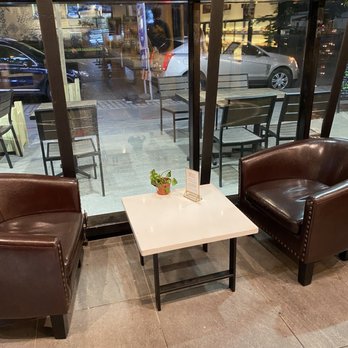 Paris Baguette - two chairs and a table in front of a large window - Bakeries Near Me - Philadelphia, Pennsylvania Paris Baguette - two chairs and a table in front of a large window - Bakeries Near Me - Philadelphia, Pennsylvania
