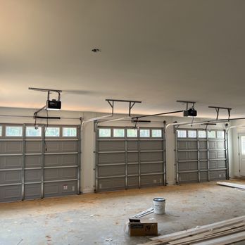 Up Down Garage Doors - Inside with three new garage doors and motors - Garage Door Services Near Me Up Down Garage Doors - Inside with three new garage doors and motors - Garage Door Services Near Me