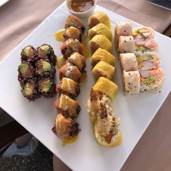 MoCA Asian Bistro - (Left to right) Salmon Avocado Roll, tiger roll, paradise roll and MoCA Roll - Asian Fusion Near Me - Woodbury, New York MoCA Asian Bistro - (Left to right) Salmon Avocado Roll, tiger roll, paradise roll and MoCA Roll - Asian Fusion Near Me - Woodbury, New York