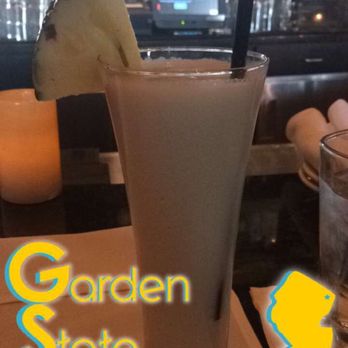 Grand Lux Cafe - I think this is actually my first piña colada . Five more please ! - American Near Me - Paramus, New Jersey