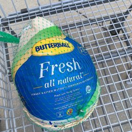 a fresh chicken in a shopping cart