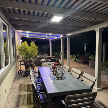 California Sunrooms - Pergola and patio cover at night. - General Contractors Near Me